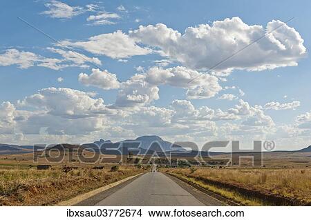 "Long straight road, vast arid landscape, sky with clouds, Isalo National Park near Ranohira, Madagascar, Africa" View Large Photo Image Picture - "Long straight road, vast arid landscape, sky with clouds, Isalo National Park near Ranohira, Madagascar, Africa". Fotosearch