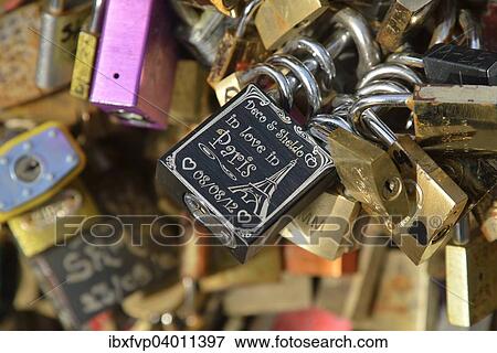 Stock Photo - "Love padlocks attached to the railing of the Pont de l'Archeveche bridge, Paris, France, Europe". Fotosearch