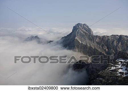 "Low stratus as seen from Saentis mountain, view of Altmann mountain, Alpstein mountain group, Appenzell, Switzerland, Europe" View Large Photo Image Stock Image - "Low stratus as seen from Saentis mountain, view of Altmann mountain, Alpstein mountain group, Appenzell, Switzerland, Europe". Fotosearch