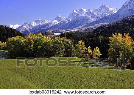 "Lower Engadine in autumn with snowy mountains, Graubunden, Switzerland, Europe" View Large Photo Image Stock Image - "Lower Engadine in autumn with snowy mountains, Graubunden, Switzerland, Europe". Fotosearch