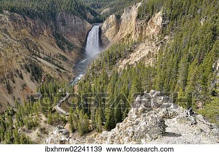 Stock Photo - "Lower Falls with the Red Rock Trail, Grand Canyon of the Yellowstone River, view from North Rim, Yellowstone National Park, Wyoming, USA". Fotosearch