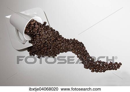Lying white coffee cup with coffee beans View Large Photo Image Stock Image - Lying white coffee cup with coffee beans. Fotosearch