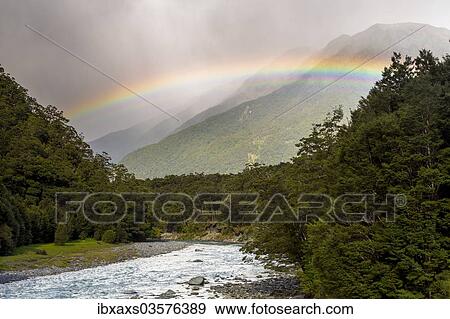Stock Photo - "Makarora River with a rainbow, Makarora, Otago Region, New Zealand, Oceania". Fotosearch
