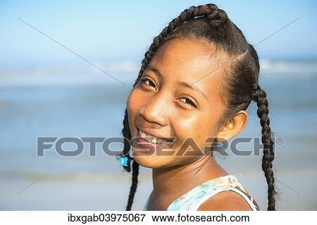 Stock Photo - "Malagasy girl, 15-16 years, on the beach, Morondava, Toliara province, Madagascar, Africa". Fotosearch