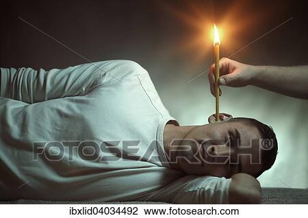 "Man, 24, is being treated with an ear candle" View Large Photo Image Stock Image - "Man, 24, is being treated with an ear candle". Fotosearch