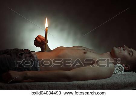 "Man, 24 years, with a body candle" View Large Photo Image Stock Image - "Man, 24 years, with a body candle". Fotosearch