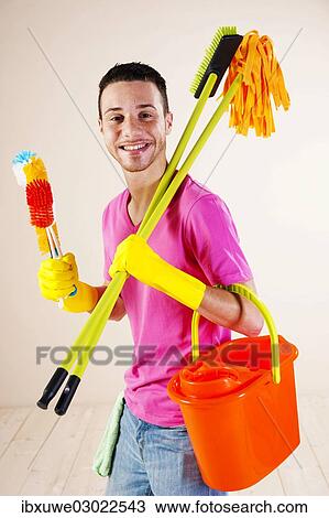 "Man holding cleaning products in his hands, Mannheim, Baden-Wurttemberg, Germany, Europe" View Large Photo Image Stock Image - "Man holding cleaning products in his hands, Mannheim, Baden-Wurttemberg, Germany, Europe". Fotosearch