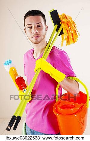 "Man holding cleaning products in his hands, Mannheim, Baden-Wurttemberg, Germany, Europe" View Large Photo Image Stock Photo - "Man holding cleaning products in his hands, Mannheim, Baden-Wurttemberg, Germany, Europe". Fotosearch