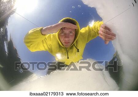 "Man looking into an ice hole on the frozen Black Sea, a rare phenomenon which occured last in 1977, Odessa, Ukraine, Eastern Europe, Europe" View Large Photo Image Stock Image - "Man looking into an ice hole on the frozen Black Sea, a rare phenomenon which occured last in 1977, Odessa, Ukraine, Eastern Europe, Europe". Fotosearch