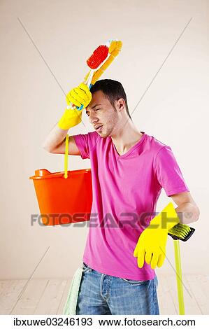 "Man looking tired and stressed from cleaning, Mannheim, Baden-Wurttemberg, Germany, Europe" View Large Photo Image Stock Image - "Man looking tired and stressed from cleaning, Mannheim, Baden-Wurttemberg, Germany, Europe". Fotosearch