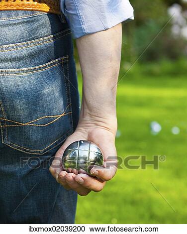 "Man playing boules, petanque, preparing to throw, Hesse Germany, Europe" View Large Photo Image Stock Image - "Man playing boules, petanque, preparing to throw, Hesse Germany, Europe". Fotosearch