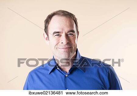 Stock Image - "Man smiling, portrait". Fotosearch