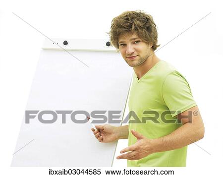 Man standing in front of a flip chart View Large Photo Image Stock Photography - Man standing in front of a flip chart. Fotosearch