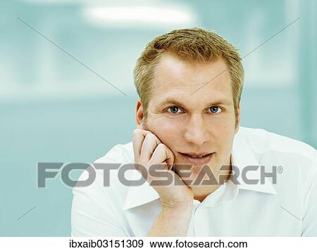 Man supporting his head on his hand View Large Photo Image Stock Photo - Man supporting his head on his hand. Fotosearch