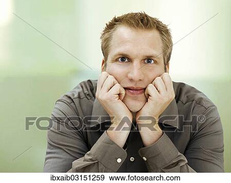 Man supporting his head on his hands View Large Photo Image Stock Photo - Man supporting his head on his hands. Fotosearch