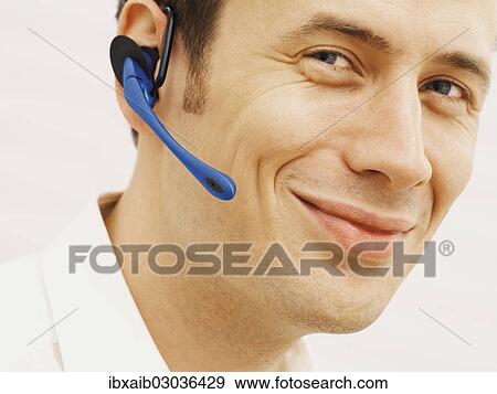 Man wearing a headset View Large Photo Image Stock Photo - Man wearing a headset. Fotosearch