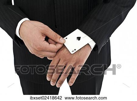 Man wearing a suit pulling an ace of spades out of his sleeve View Large Photo Image Stock Image - Man wearing a suit pulling an ace of spades out of his sleeve. Fotosearch