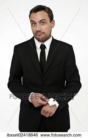 Man wearing a suit pulling an ace of spades out of his sleeve View Large Photo Image Stock Photograph - Man wearing a suit pulling an ace of spades out of his sleeve. Fotosearch