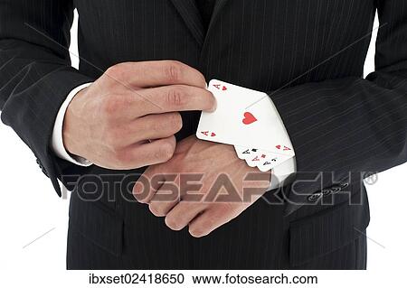 Man wearing a suit pulling several aces out of his sleeve View Large Photo Image Stock Image - Man wearing a suit pulling several aces out of his sleeve. Fotosearch