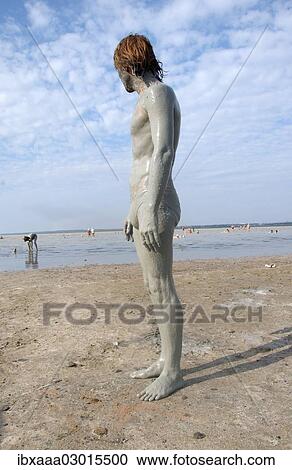 "Man with a mud-covered body, at the Kuyalnik mud health spa, Kuyalnik Estuary, Odessa, Odessa Oblast, Ukraine, Europe" View Large Photo Image Stock Image - "Man with a mud-covered body, at the Kuyalnik mud health spa, Kuyalnik Estuary, Odessa, Odessa Oblast, Ukraine, Europe". Fotosearch