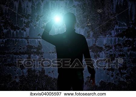 Man with flashlight in dark urban setting View Large Photo Image Stock Photo - Man with flashlight in dark urban setting. Fotosearch