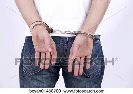 Stock Image - Man with handcuffs. Fotosearch
