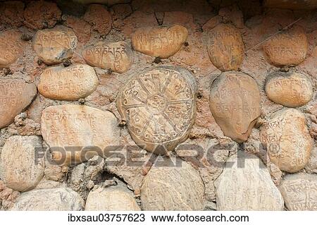 "Mani stones with Tibetan inscriptions on wall, Buddhist Mani wall at Ghami, Upper Mustang, Nepal, Asia" View Large Photo Image Stock Image - "Mani stones with Tibetan inscriptions on wall, Buddhist Mani wall at Ghami, Upper Mustang, Nepal, Asia". Fotosearch