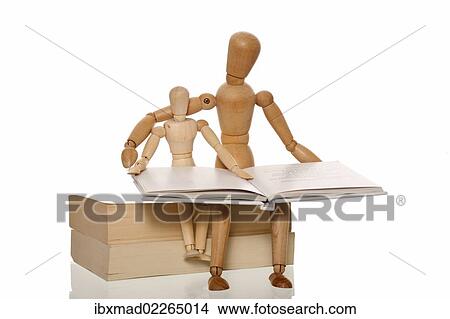 Picture - Mannequin reading a book to a smaller mannequin. Fotosearch