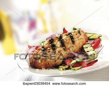 Marinaded char-grilled chicken with roasted courgettes and peppers View Large Photo Image Picture - Marinaded char-grilled chicken with roasted courgettes and peppers. Fotosearch
