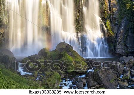 "Marokopa Falls in the evening light with a rainbow, Te Anga, Waikato Region, New Zealand, Oceania" View Large Photo Image Stock Photography - "Marokopa Falls in the evening light with a rainbow, Te Anga, Waikato Region, New Zealand, Oceania". Fotosearch