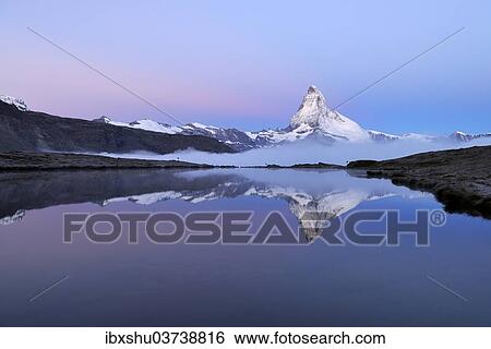 "Matterhorn reflected in Lake Stellisee at dusk, Valais Alps, Canton of Valais, Switzerland, Europe" View Large Photo Image Stock Photograph - "Matterhorn reflected in Lake Stellisee at dusk, Valais Alps, Canton of Valais, Switzerland, Europe". Fotosearch
