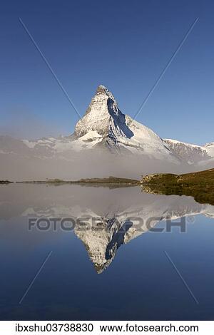 "Matterhorn reflected in Lake Stellisee, with fog, Valais Alps, Canton of Valais, Switzerland, Europe" View Large Photo Image Stock Image - "Matterhorn reflected in Lake Stellisee, with fog, Valais Alps, Canton of Valais, Switzerland, Europe". Fotosearch