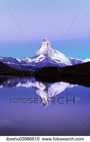 Stock Image - "Matterhorn reflected in lake Stellisee, at dusk, Valais Alps, Canton of Valais, Zermatt, Switzerland, Europe". Fotosearch