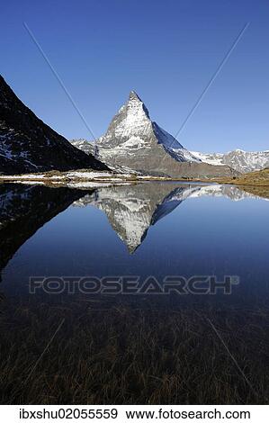 Stock Photo - "Matterhorn reflected in Lake Riffelsee, Zermatt, Valais, Switzerland, Europe". Fotosearch