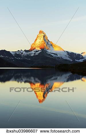 Stock Photo - "Matterhorn reflected in lake Stellisee, at sunrise, Valais Alps, Canton of Valais, Zermatt, Switzerland, Europe". Fotosearch