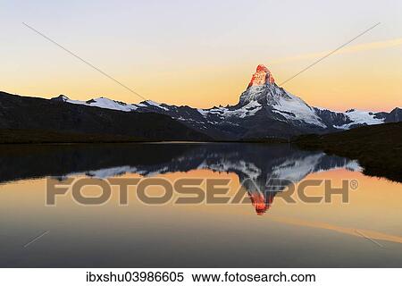 Stock Photography - "Matterhorn reflected in lake Stellisee, at sunrise, Valais Alps, Canton of Valais, Zermatt, Switzerland, Europe". Fotosearch