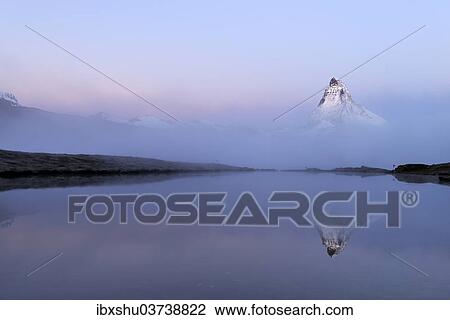 "Matterhorn shrouded in mist, with Lake Stellisee at the front, Valais Alps, Canton of Valais, Switzerland, Europe" View Large Photo Image Stock Image - "Matterhorn shrouded in mist, with Lake Stellisee at the front, Valais Alps, Canton of Valais, Switzerland, Europe". Fotosearch