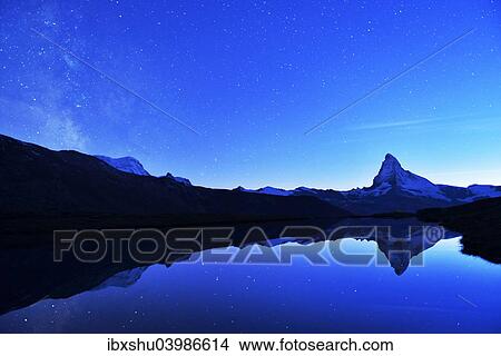 Picture - "Matterhorn with Milky Way reflected in lake Stellisee, at night, Valais Alps, Canton of Valais, Zermatt, Switzerland, Europe". Fotosearch