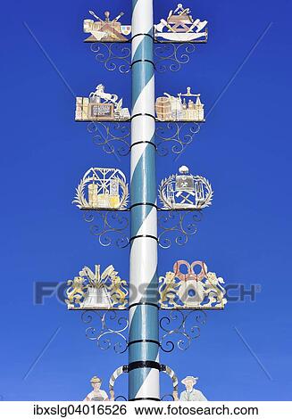 "Maypole with wooden signs of local trades, Miesbach, Bavaria, Germany, Europe" View Large Photo Image Stock Photograph - "Maypole with wooden signs of local trades, Miesbach, Bavaria, Germany, Europe". Fotosearch