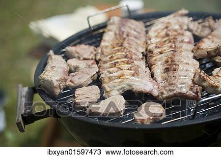 Meat on a barbecue View Large Photo Image Stock Image - Meat on a barbecue. Fotosearch
