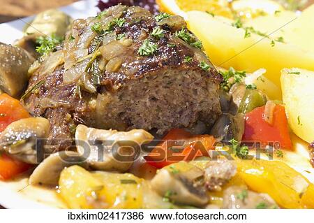 "Meatloaf with mushrooms, peppers and boiled potatoes" View Large Photo Image Stock Photograph - "Meatloaf with mushrooms, peppers and boiled potatoes". Fotosearch