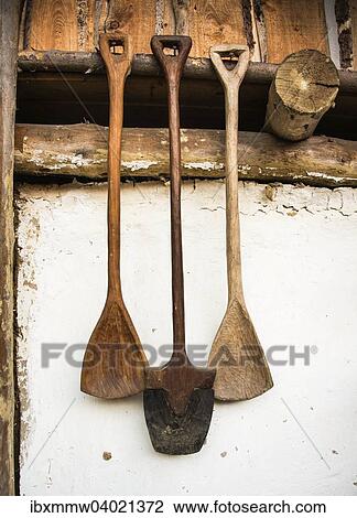 Stock Image - "Medieval wooden spades hanging on a wall, chalet, Austria, Europe". Fotosearch