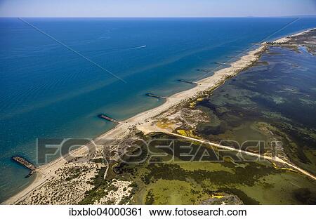 "Mediterranean coast, brackish water area of? Çï? Çïthe Etang de Melegal, Le Grau-du-Roi, Camargue, Languedoc-Roussillon, France, Europe" View Large Photo Image Stock Image - "Mediterranean coast, brackish water area of? Çï? Çïthe Etang de Melegal, Le Grau-du-Roi, Camargue, Languedoc-Roussillon, France, Europe". Fotosearch