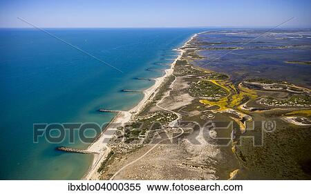 "Mediterranean coast, brackish water area of? Çï? Çïthe Etang de Melegal, Le Grau-du-Roi, Camargue, Languedoc-Roussillon, France, Europe" View Large Photo Image Stock Photography - "Mediterranean coast, brackish water area of? Çï? Çïthe Etang de Melegal, Le Grau-du-Roi, Camargue, Languedoc-Roussillon, France, Europe". Fotosearch