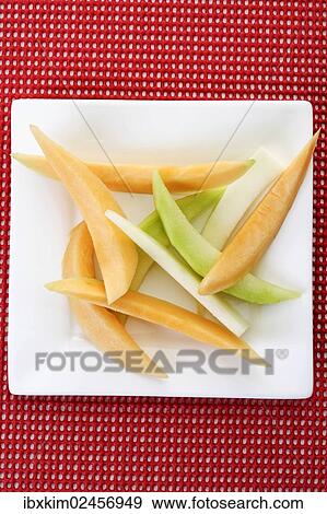Melon slices View Large Photo Image Stock Photo - Melon slices. Fotosearch