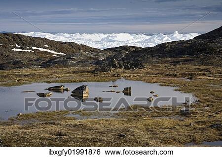 "Meltwater pond in front of Kangia Glacier, Ilulissat, Greenland, North America" View Large Photo Image Stock Photograph - "Meltwater pond in front of Kangia Glacier, Ilulissat, Greenland, North America". Fotosearch