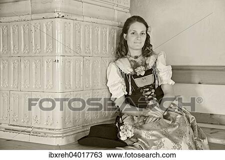 Stock Image - "Michaela Eichhorst, sutler of the Aschbacher Schutzen, wearing a typical Tyrolean traditional costume from the Achensee region, Achenkirch, Tyrol, Austria, Europe". Fotosearch