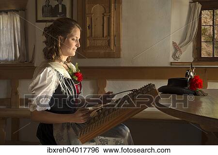 Stock Photograph - "Michaela Eichhorst, sutler of the Aschbacher Schutzen, wearing a typical Tyrolean traditional costume from the Achensee region, Achenkirch, Tyrol, Austria, Europe". Fotosearch