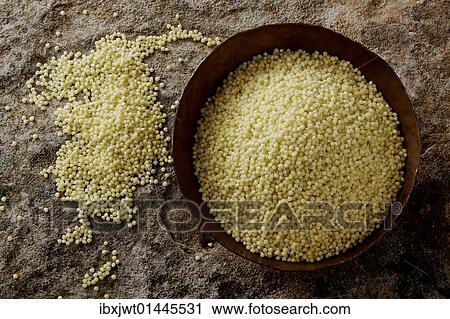 Millet (Panicum miliaceum) in a copper bowl on a stone surface View Large Photo Image Stock Image - Millet (Panicum miliaceum) in a copper bowl on a stone surface. Fotosearch