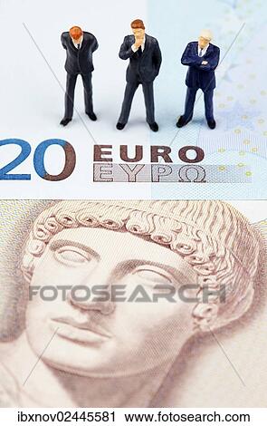 Miniature figurines of businessmen on euro and Greek drachma banknotes View Large Photo Image Stock Image - Miniature figurines of businessmen on euro and Greek drachma banknotes. Fotosearch